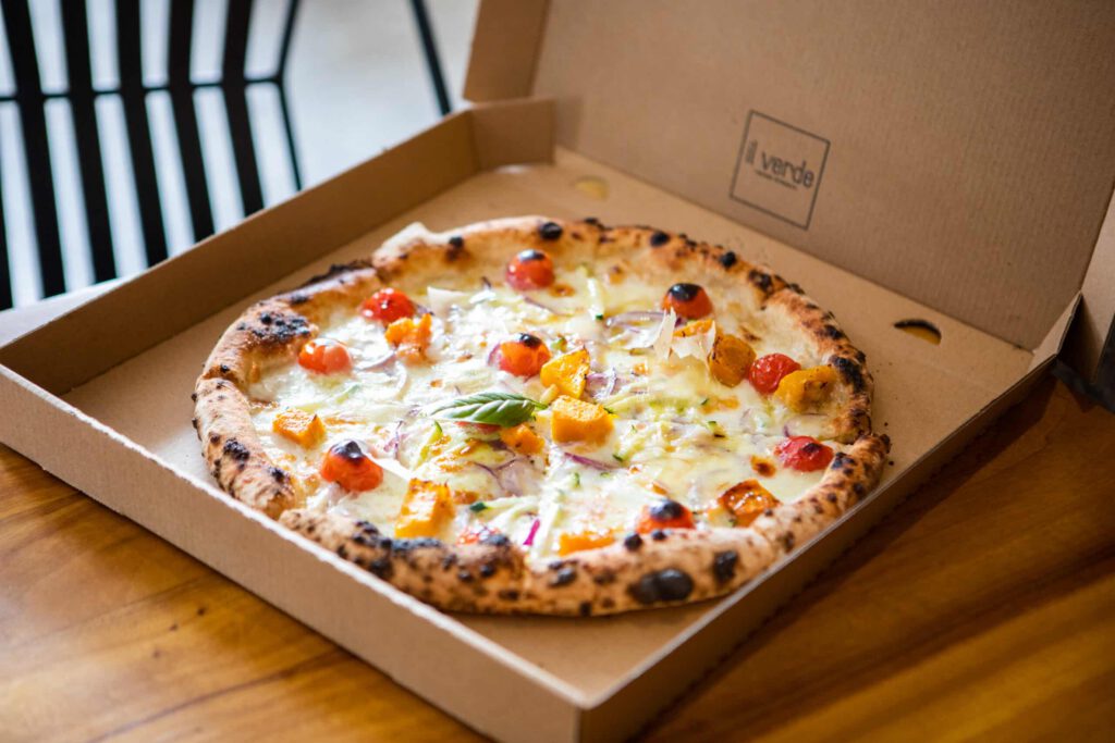 Wood-fired gourmet pizza in takeaway box at Il Verde Italian restaurant on King Street in Bowen Hills Brisbane