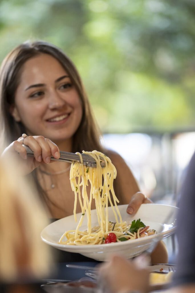 Guest enjoying spaghetti at Il Verde Italian restaurant on King Street in Bowen Hills Brisbane