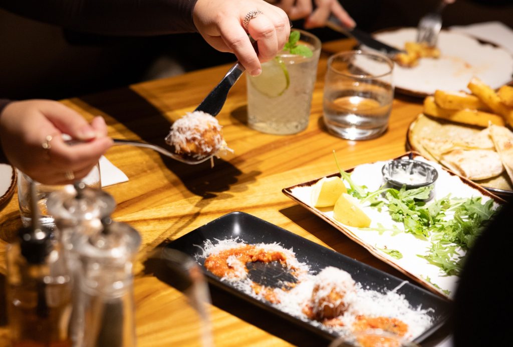 Grana Padano cheese and arancini at Il Verde Italian restaurant in Bowen Hills Brisbane