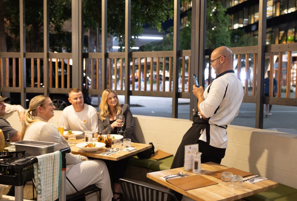 Chef presenting fresh pasta to guests at Il Verde Italian restaurant in Bowen Hills Brisbane